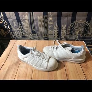 White Adidas SuperStar shoes used